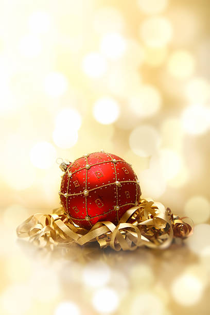 istock Red bauble and golden ribbon 168519058