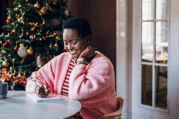 istock Woman Writing Her New Year's Resolutions 1685207506