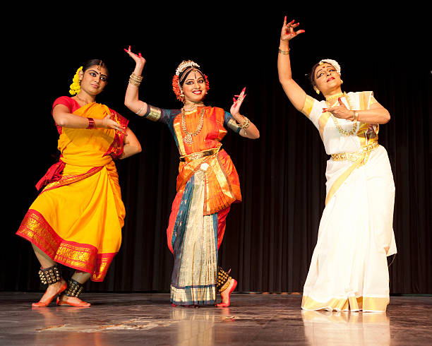 Traditional Indian Dancers Traditional classical Indian dancers on stage color image performing arts event performer stage theater stock pictures, royalty-free photos & images