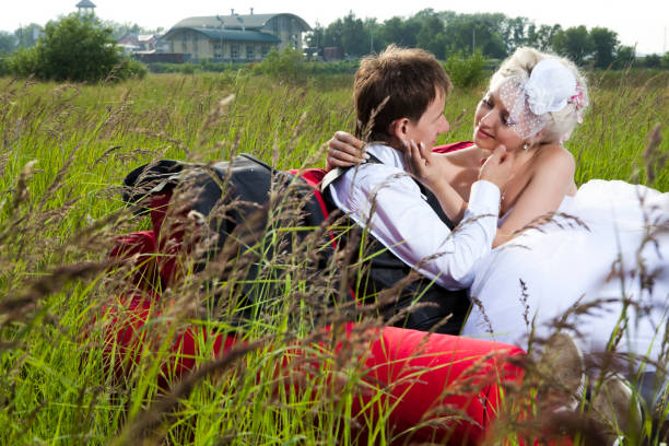istock Newlyweds sitting on the couch in  field 168522027