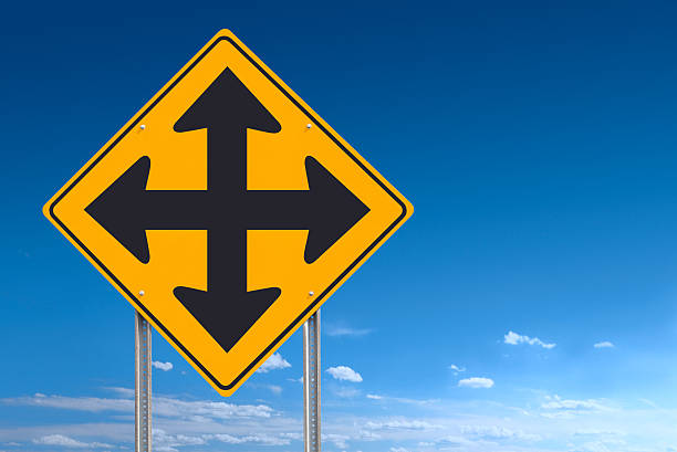 istock Crossroads Traffic Sign Post Over Blue Sky Background 168522159
