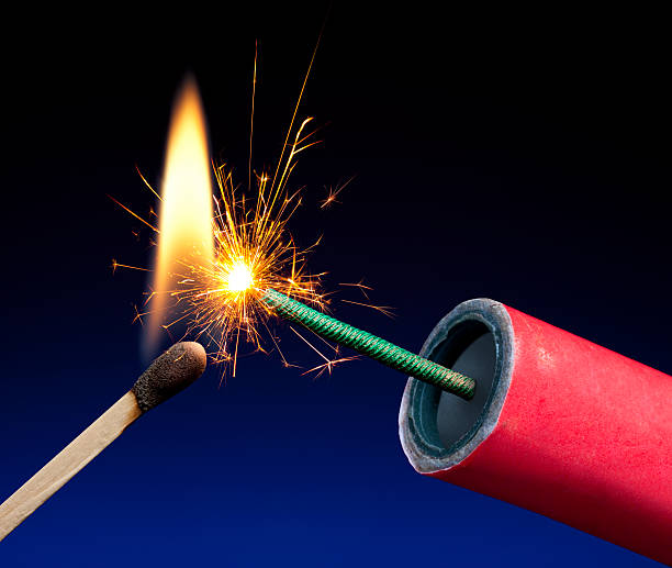 Lit Explosive Fuse Crackling and Sparking Lit Explosive Fuse Crackling and Sparking lit match stock pictures, royalty-free photos & images