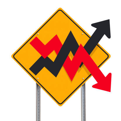 A traffic sign post indicating a volatile financial market business concept using a road sign - includes a precise clipping path