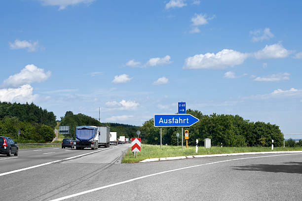 German highway, road sign - Ausfahrt/Exit German highway, road sign - Ausfahrt/Exit. Photography has been taken during driving, some motion blur autobahn stock pictures, royalty-free photos & images