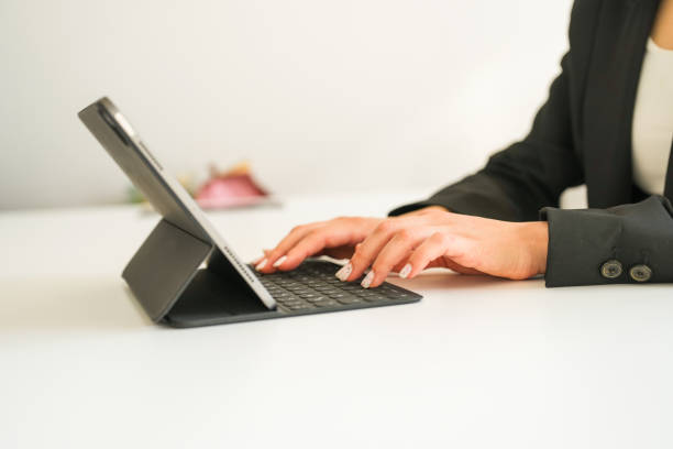 istock businesswoman writing on tablet close-up 1685271332