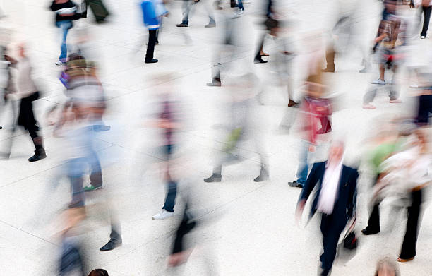 istock people walking in railroad station 168529121