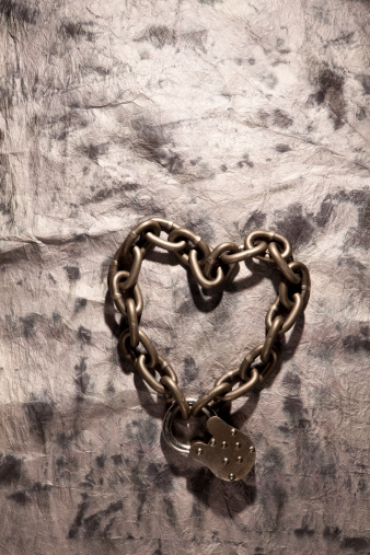 Chain in shape of heart with old lock. Concept for love, marriage and united.