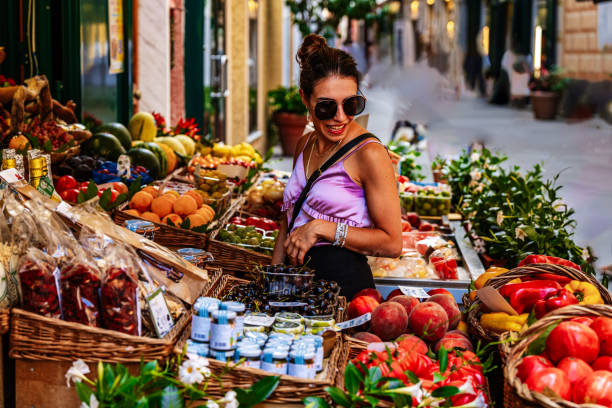 istock Beautiful Woman Looking at Fresh Fruit 1685337539