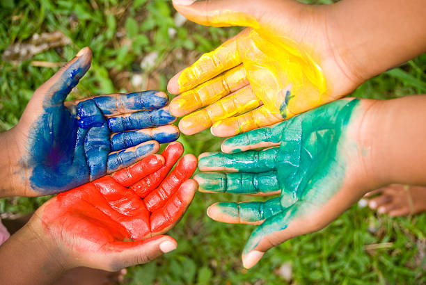 istock four hands and finger painting colors 168533828
