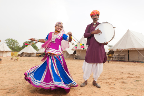Traditional Rajasthani bedouin folk dancers dance at Puskar Fair tented encampment