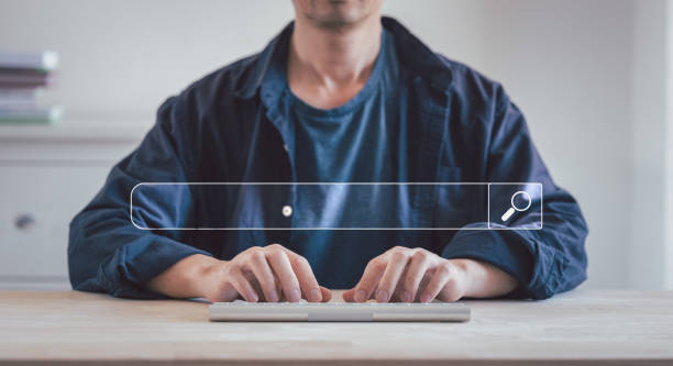 Data Search Technology Search Engine Optimization. man's hands are using a computer keyboard to Searching for information. Using Search Console with your website. stock photo