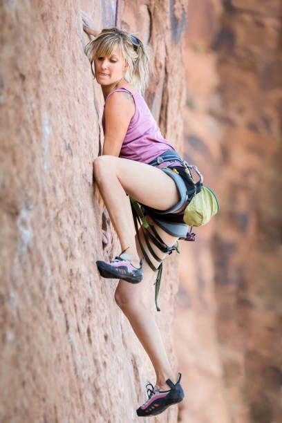 istock Young Woman Rock Climber on a sandstone cliff 168542940