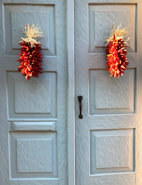 istock Santa Fe, NM: Red Chili Pepper Ristras, Old Gray Doors 1685469093