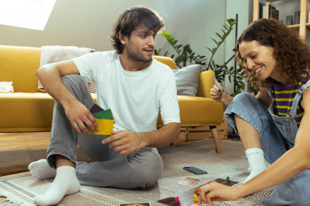 istock Young couple playing a board game and enjoying 1685505795