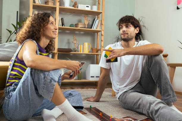 istock Young couple playing a board game and having fun 1685505811