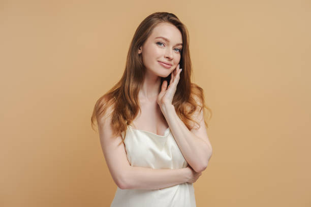 istock Smiling female with beautiful long hair looking at camera alone 1685511625