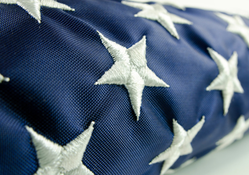 An American flag close-up and folded. Stars only