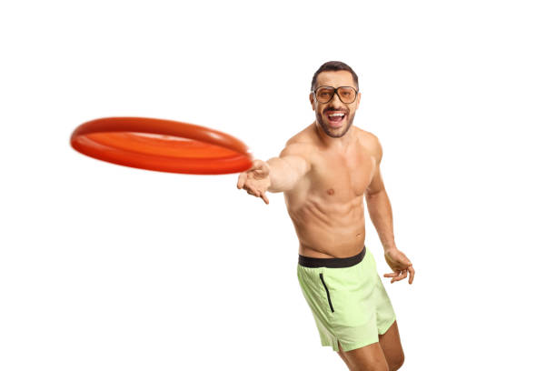 istock Handsome young man in swimwear throwing a flying disk 1685530599