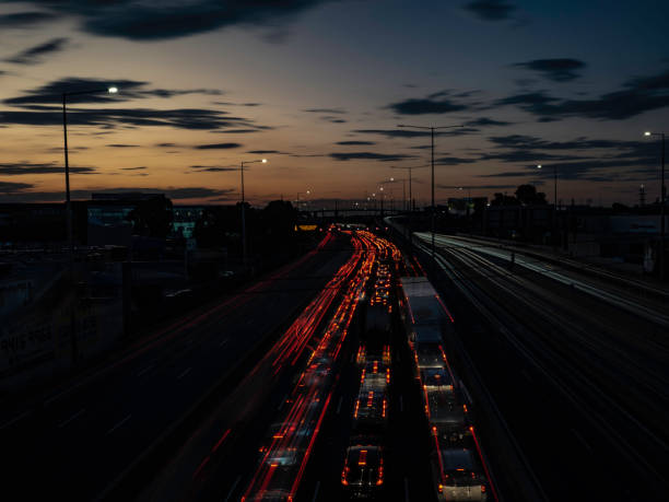 istock Multi lane free way with light trails and urban skyline 1685546869