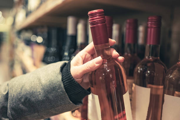 istock Woman choosing rose wine 1685631637