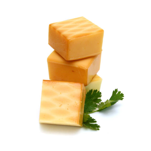 istock Cubes of cheddar cheese isolated on white 1685679067