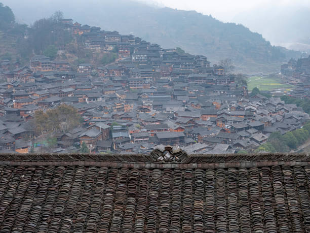 The Miao village behind the black old-fashioned roof, Guizhou, China. The Miao village behind the black old-fashioned roof, Xijiang Qianhu Miao village, Guizhou, China. qiandongnan miao and dong autonomous prefecture stock pictures, royalty-free photos & images
