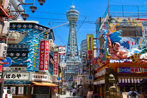 Cityscape of Shinsekai district of Osaka with Tsutenkaku tower in Osaka, Japan