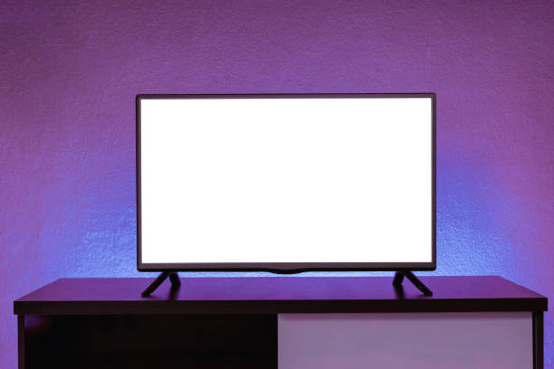 istock Modern 4K LCD television with white screen on cabinet in front of wall in background, interior design, cut out screen 1685727868
