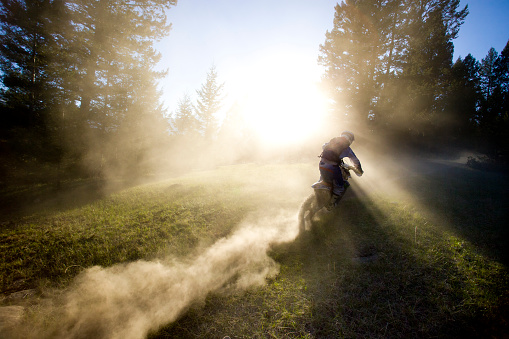 A motocross rider hits a dusty trail in British Columbia, Canada.