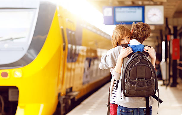 young adults hugging at the railway station young adults hugging at the railway station gouda south holland stock pictures, royalty-free photos & images