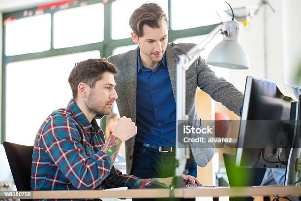 Two Colleagues At A Start Up Enjoying Work Stock Photo - Download Image Now - Adult, Adults Only, Berlin