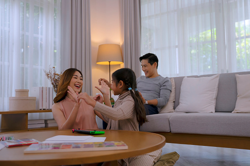 Couple with daughter make leisure activity together. Family and relationship concept.