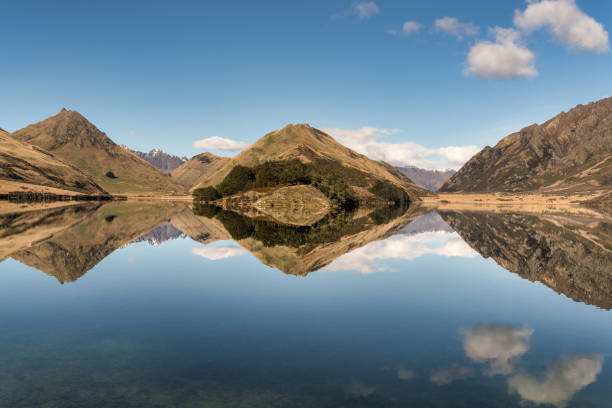 istock Moke Lake mountain and sky reflections 1685812140