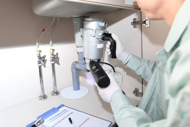 istock Asian male worker installing a disposer under the sink 1685812998