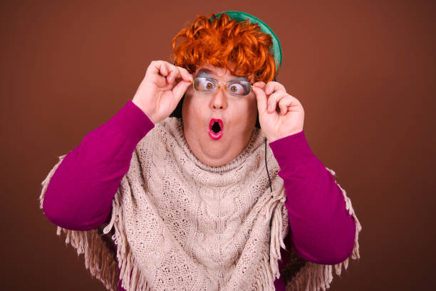 istock Drag queen posing in the studio against a brown background. 1685813063