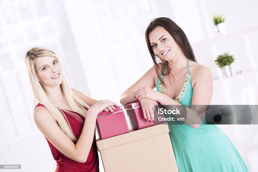 Moving to new flat Female roommates moving into their dorm room. Relocation Stock Photo