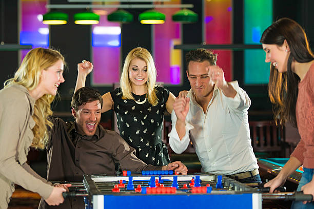 istock Group of Friends Playing Foosball 168588173