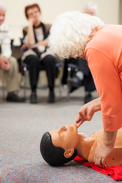 istock Senior Woman Demonstrating CPR On A Dummy 168588364