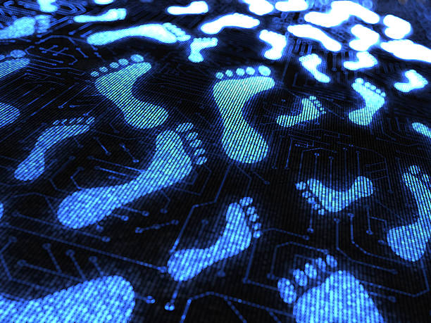 Blue footprints over a circuit board stock photo