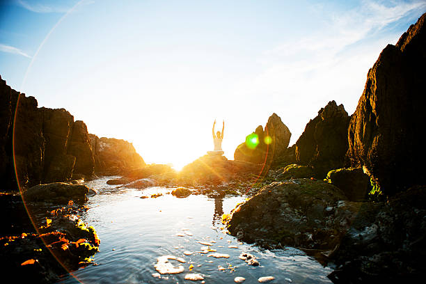istock Female meditating on the rocks 168590854