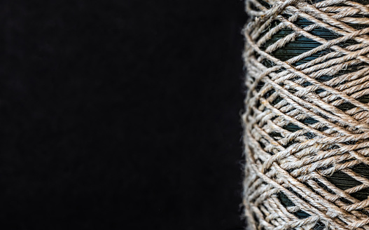 Rope coil on dark background with copy space