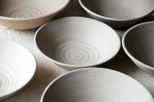 Pottery, ceramic and handmade products on a shelf in a workshop and showroom. Closeup of clay vases and earthenware on display in a craft store. Variety of finished clayware in a small business