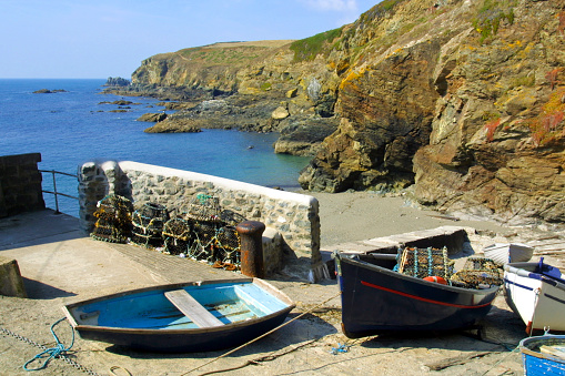 England, Cornwall, small boats pulled up the beach at Lizard Point, the southernmost point on the UK mainland