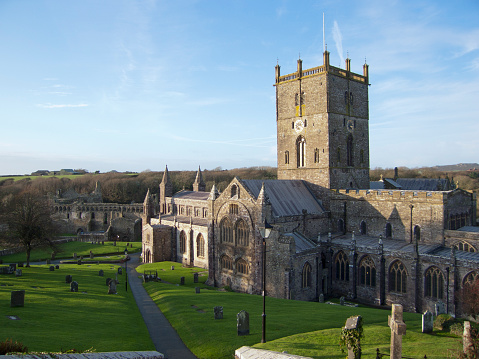 Winter afternoon sunshine on the famous cathedral in the UK's smallest city of St Davids, Pembrokeshire, Wales, UK