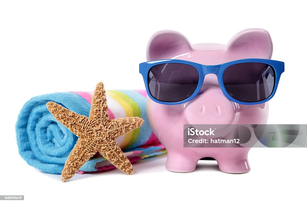 Piggy Bank on beach vacation Pink piggy bank wearing blue sunglasses on a beach with starfish and beach towel.  Isolated on white.  Alternative version shown below: Beach Towel Stock Photo