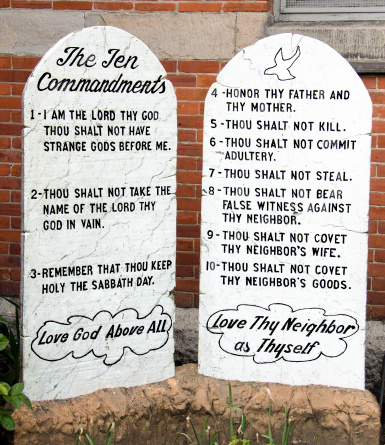 The ten commandments etched into marble tablets. These are near the entryway to a church.