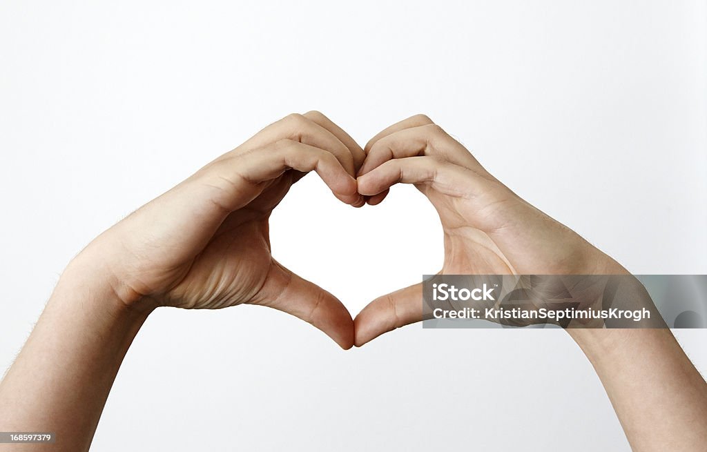Mani facendo heartshape - Foto stock royalty-free di Simbolo di cuore