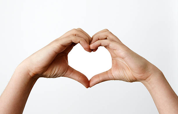 Hands making heartshape stock photo