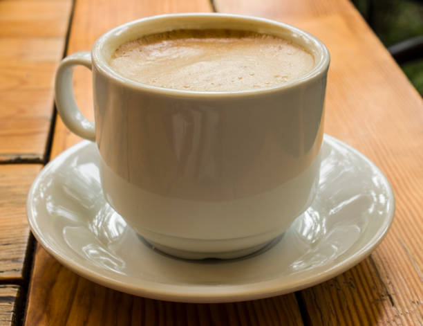 istock Cup of coffee on the table. 1685992937