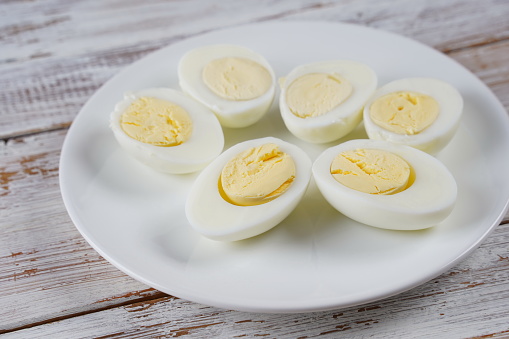 Halves of hard boiled eggs on a plate